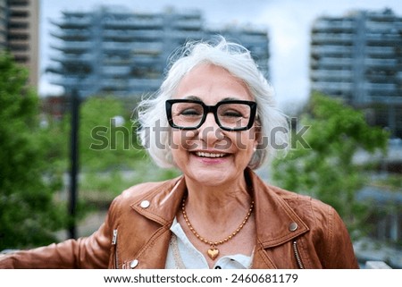 Similar – Image, Stock Photo Smiling senior woman at home looking at camera