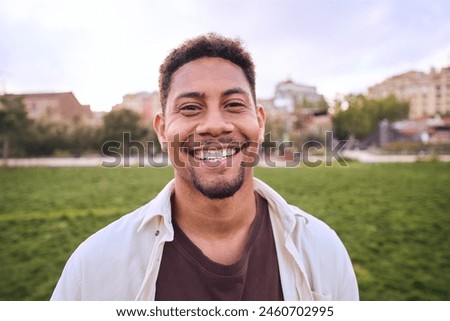 Image, Stock Photo Stylish attractive guy with dreadlocks is recording a song in the studio. A young singer in black studio headphones stands in front of a microphone in the blurred background. Low key lighting.