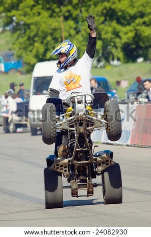 MOSCOW,RUSSIA - 06 JUNE, 2008:Stuntman Igor Pereversev on ATV making trick at Moscow festival of stuntmen, Russia, Moscow, 06 June 2008