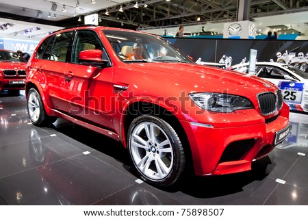 MOSCOW, RUSSIA - AUGUST 25: Red jeep car BMW X5 M  on display at Moscow International exhibition InterAuto on August 25, 2010 in Moscow, Russia.