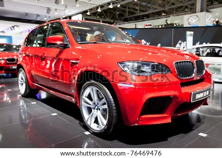 MOSCOW, RUSSIA - AUGUST 25: Red jeep car BMW X5 M on display at Moscow International exhibition InterAuto on August 25, 2010 in Moscow, Russia.