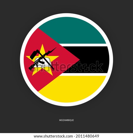 Mozambique circle flag with white border on dark grey background. Mozambique button flag isolated on barely dark background.