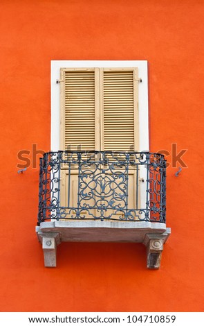 The Renovated Facade of the Old Italian House with Balcony