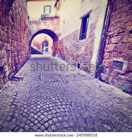 Narrow Street with an Arch in the Medieval Italian City, Instagram Effect