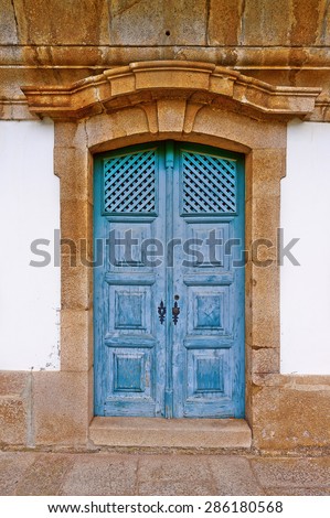 Wooden Door in the Wall of Portuguese Home