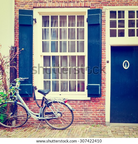 Bike in Front of a Brick Facade of the Old Dutch House, Instagram Effect