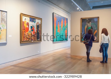 SAINT PETERSBURG, RUSSIA - OCTOBER 01, 2015: Two girls looking at Impressionist paintings Matisse at the Museum of the General Staff (branch of  Hermitage - one of the largest museums in the world)