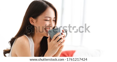 Similar – Image, Stock Photo Asian woman with coffee talking smartphone at cafe table
