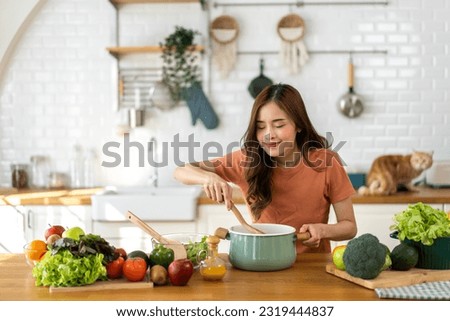 Similar – Foto Bild Frau bereitet Essen in der Küche vor.