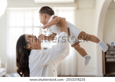 Similar – Image, Stock Photo baby playing on the floor II