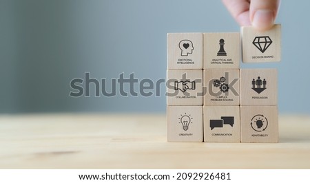 Soft skills concept. Used for presentation, banner. Hand puts wooden cubes with icons of 'SOFT SKILLS' ; creativity, EQ, Problem solving, persuasion, collaboration, adaptability  on grey background. Foto d'archivio © 