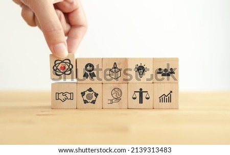 Core values,corporate values concept.  Company culture and strategy related to business and customer relationships, growth. Principles guide company's action. Put wooden cubes with core values icons. Сток-фото © 