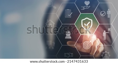 Work safety concept. Businessman touching the icon of  safety at workplace sourrounded by safety first, protections, health, regulations and insurance.  Working standard process. Zero accidents. Stockfoto © 