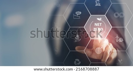 Net zero and carbon neutral concept. Net zero greenhouse gas emissions target. Climate neutral long term strategy. Businessman touching on net zero icon with decarbonization icon on smart background. 商業照片 © 
