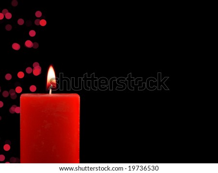 Lighted Christmas Candle with lights in dark background