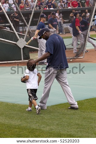 BALTIMORE - MAY 1: David Ortiz and son D'Angelo walk on the field before a game at Camden Yards on May 1, 2010 in Baltimore, Maryland