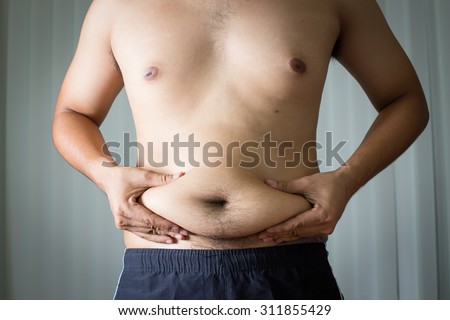 Fat man in house with gray background