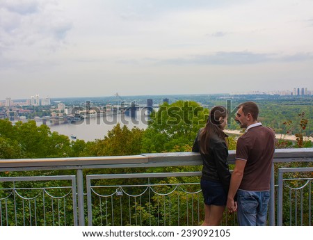 UKRAINE, KIEV - September 9,2013: Couple in love looking at the panorama of Kiev, Ukraine
