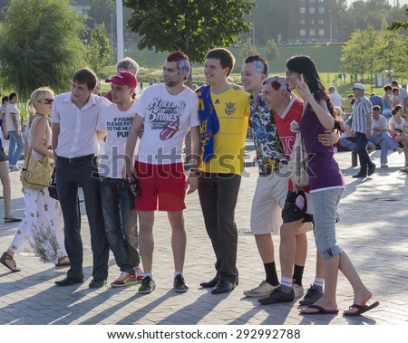 Donetsk, Ukraine - June 11, 2012: Fans from different countries together are photographed before the match at the European Championship in football