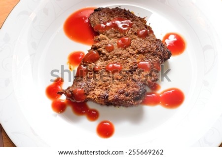 Strip Steak/beef strip steak under ketchup