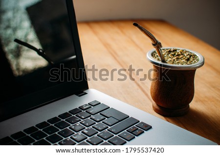 Top view of a laptop with an Argentine Mate on a wooden desk table Photo stock © 