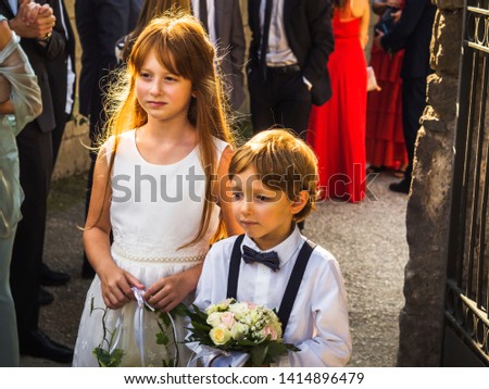 Similar – Foto Bild Ringträger bei Gartenhochzeit spielt mit Blumenstrauß