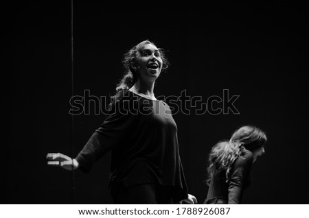 Actresses on stage in rehearsals, opposites, happiness and anguish. Black and white photography.