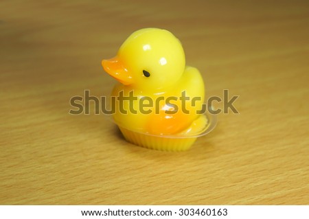 Yellow duck coconut jelly handmade on wooden background
