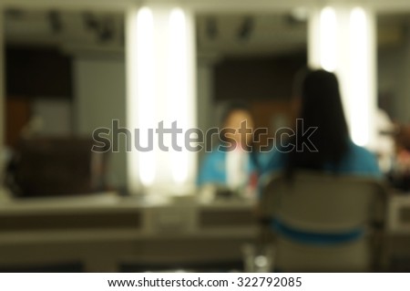 Blurry focus scene, women wait to make up