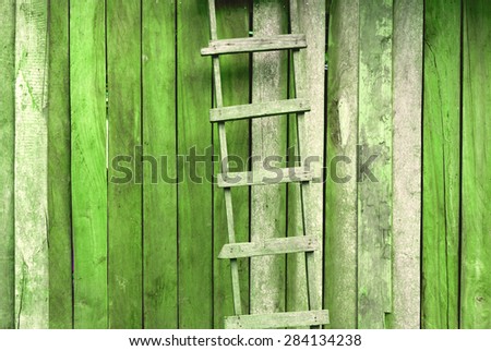Vintage green tone wooden ladder background
