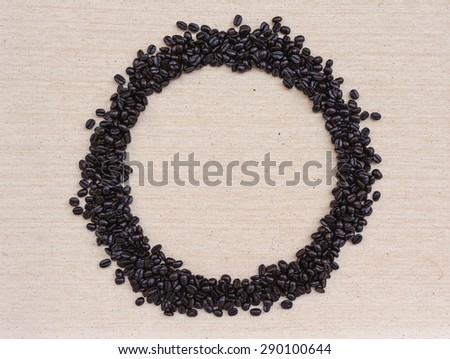 Coffee beans round frame on canvas texture background