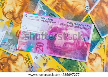 Swiss Franc money background, a pile of Swiss currency banknotes