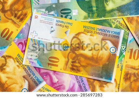 Swiss Franc money background, a pile of Swiss currency banknotes