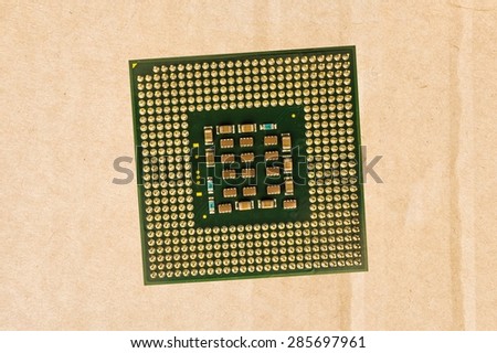 Computer processor chip (CPU) isolated on carton background