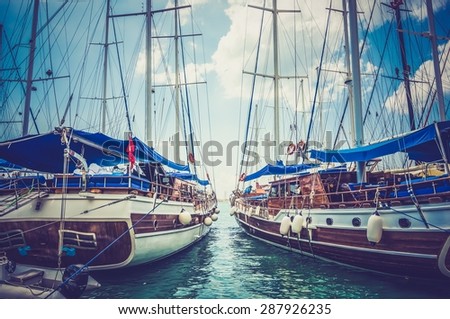 Two moored sailing boats in harbor in Turkey - retro and vintage style