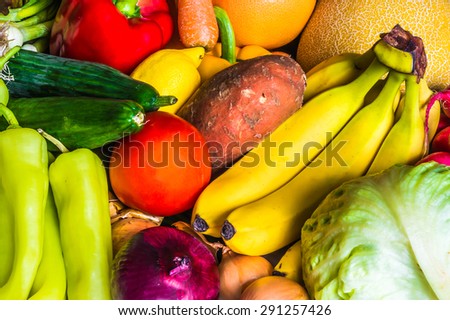 Fresh vegetable and fruit background: bananas, tomatoes, cucumbers, peppers,...
