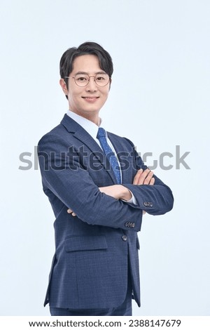 Similar – Image, Stock Photo Asian businessman standing in street