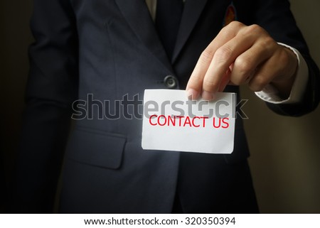 businessman showing contact us , business idea concept