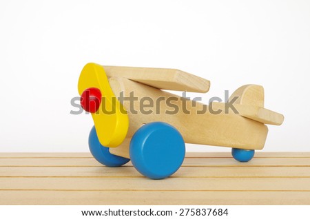 wooden plane toy isolated on white background