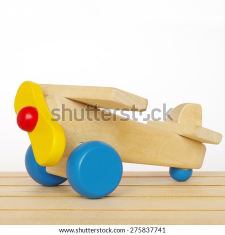 wooden plane toy isolated on white background