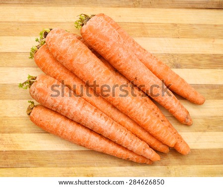 carrots isolated on wooden board