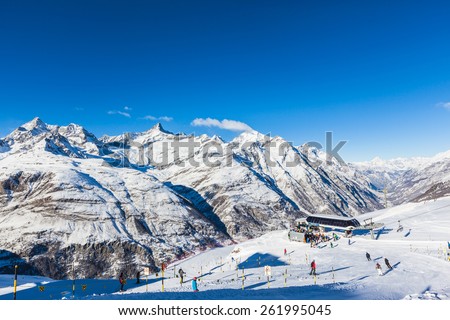 Zermatt, Switzerland - December 31, 2014 - Lots of skier having fun in the perfect area for winter sport - the slopes under the feet of Matterhorn. Photo taken near the station Riffelberg .