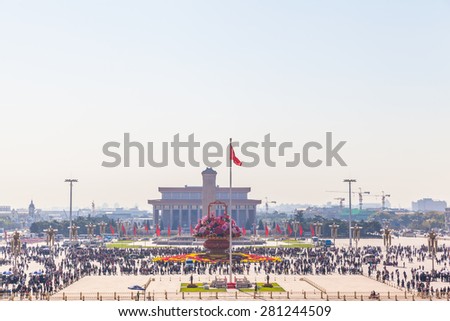 Beijing, China - October 14, 2014 - Lots of tourists on Tiananmen Square with view of Monument to the People\'s Heroes and the Great Hall of the People, Beijing, China.