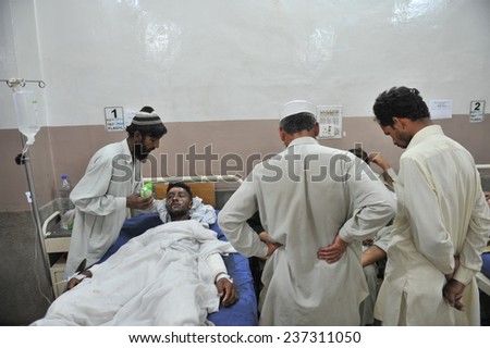 PESHAWAR, PAKISTAN - MAY 14: Victim of suicide bomb blast at police school area being admitted for treatment at Lady Reading hospital, on May  14, 2011 in Peshawar.