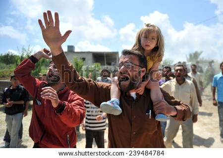 TURKISH-SYRIAN BORDER -JUNE 11, 2011: unidentified Syrian refugees, protested at the syria border   June 11, 2011 on the Turkish - Syrian border.