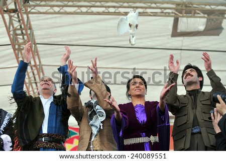VAN,TURKEY - MARCH 20: Kurds celebrating their traditional feast Newroz that means \'new day\' in kurdish on March 20, 2010 in Van, Turkey.BDP deputy Ahmet Turk, attended the ceremony.