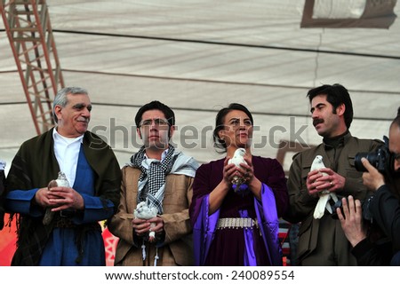 VAN,TURKEY - MARCH 20: Kurds celebrating their traditional feast Newroz that means \'new day\' in kurdish on March 20, 2010 in Van, Turkey.BDP deputy Ahmet Turk, attended the ceremony.