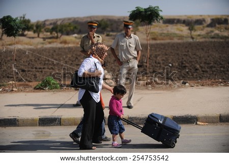 TURKISH-SYRIAN BORDER -SEPTEMBER  22, 2009: The last border crossing Syrians Fitr on September 22, 2009 on the Turkish - Syrian border.