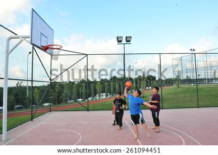 ISTANBUL, TURKEY - AUGUST 12: Children play basketball in the city park on August 12, 2012 in Istanbul, Turkey.