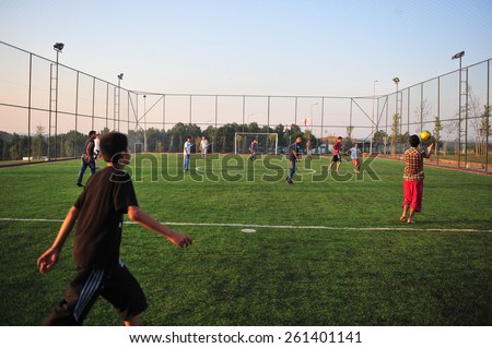 ISTANBUL ,TURKEY - JULY  12:  Students who play football in the astroturf July 12, 2012 in Istanbul, Turkey.